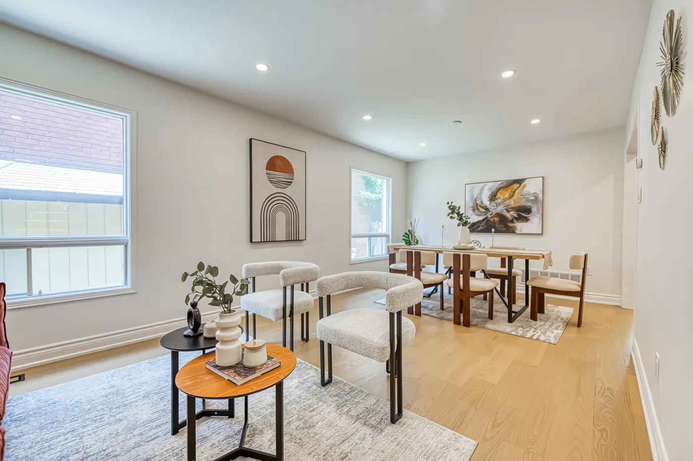 The living and dining room with oak floors.