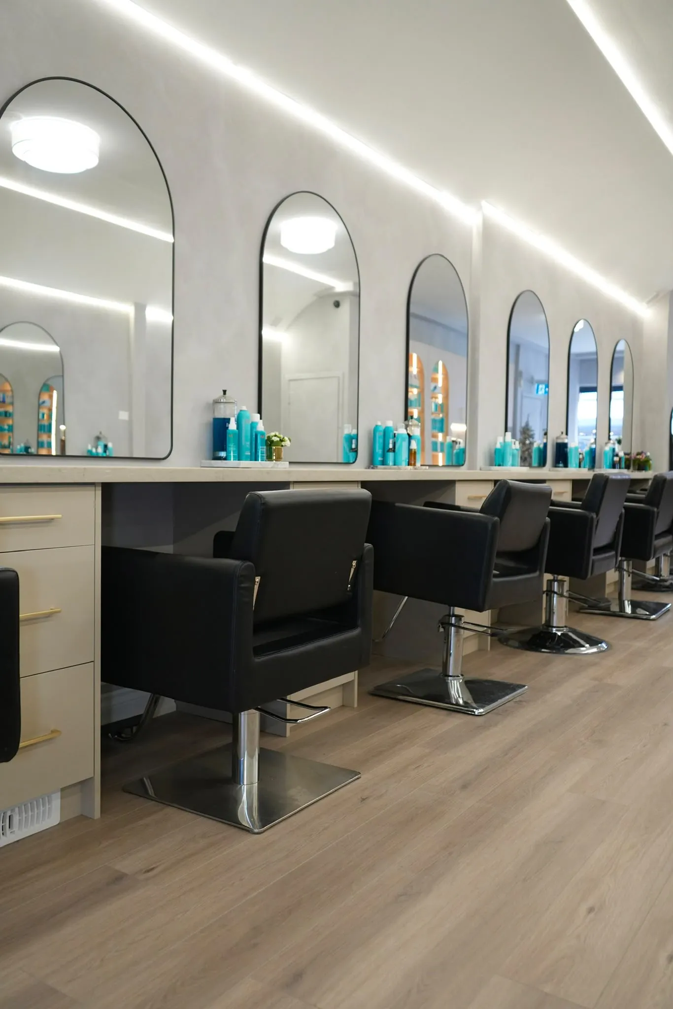Arched mirrors along the plaster wall.